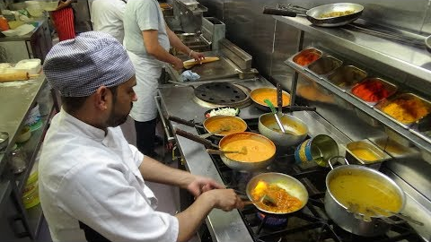 The Heat of the Curry Master's Kitchen on a Busy Friday Night at Shambhala Village Indian Restaurant
