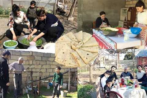 On sunny spring day in the village, two young women gathered herbs from the yard and prepared lavash