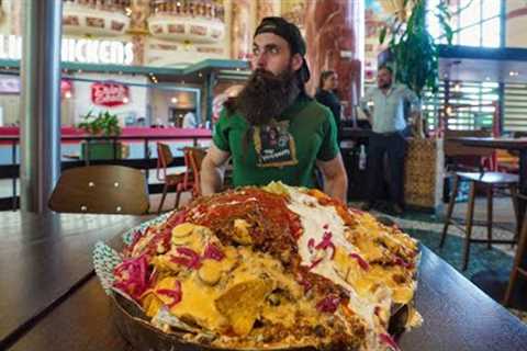 ATTEMPTING AN UNEXPECTEDLY SPICY NACHO MOUNTAIN CHALLENGE | BeardMeatsFood